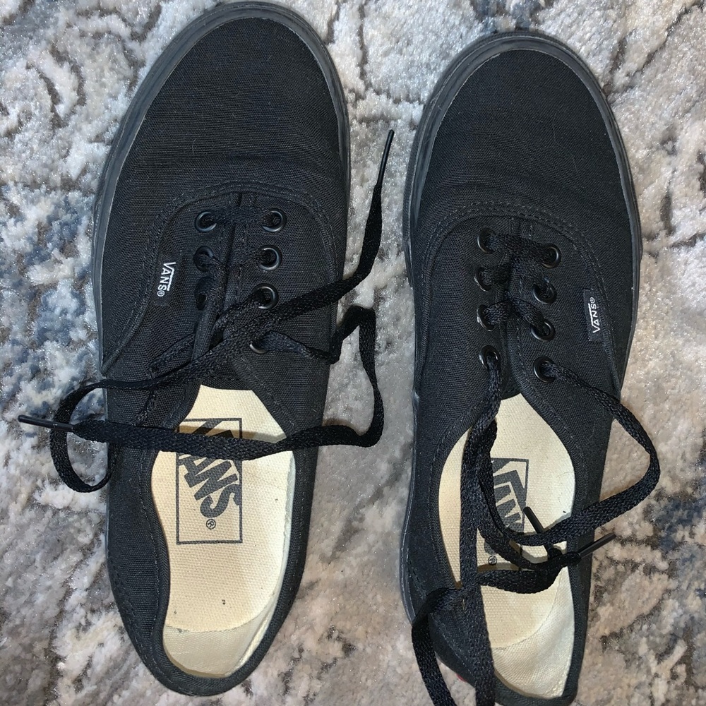 All black Vans low top